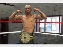 Champion in the ring with title belt